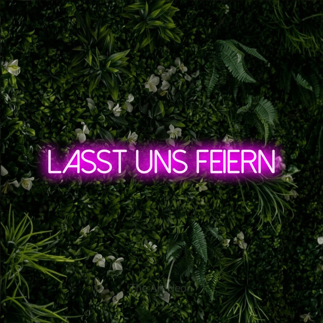 LED neon sign reading “LASST UNS FEIERN”, arranged in a single line.