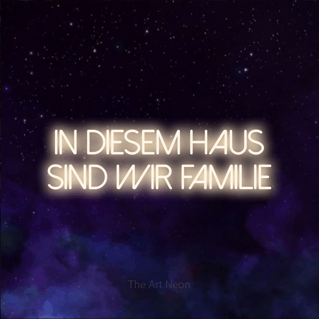 LED neon sign reading “In diesem Haus sind wir Familie”, arranged in 2 lines.