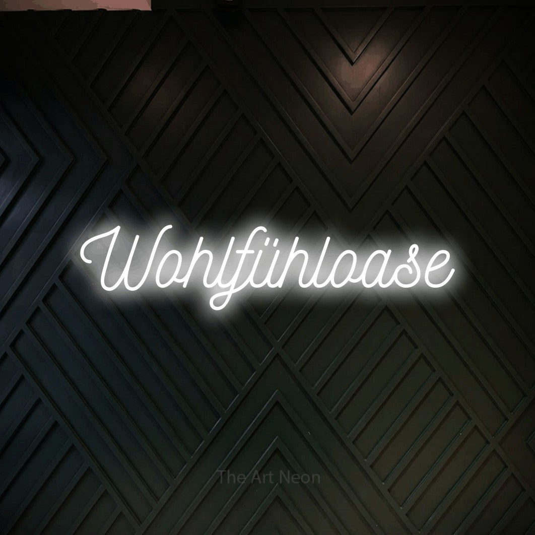 LED neon sign reading “Wohlfühloase”, arranged in a single line.