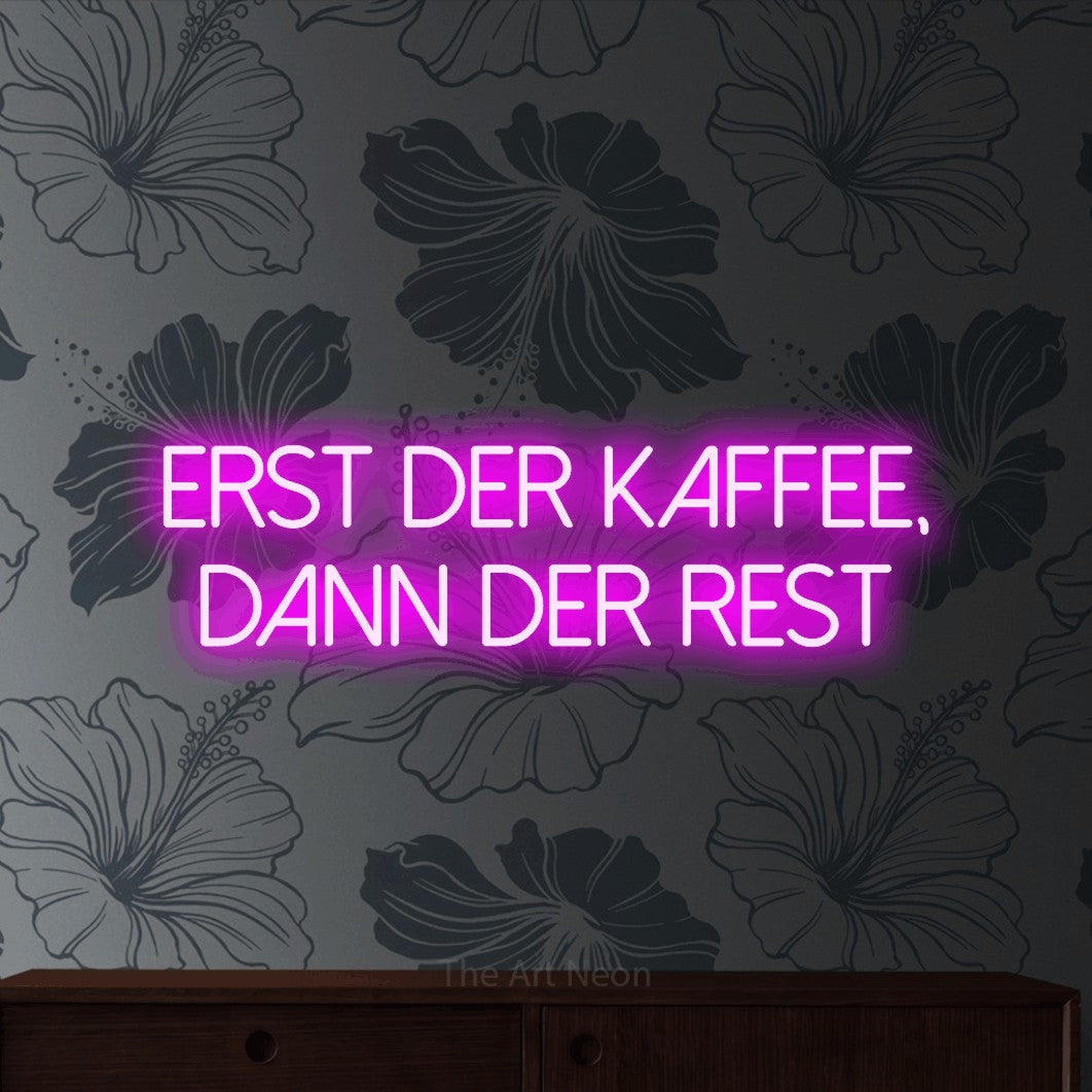 LED neon sign reading “erst der kaffee, dann der rest”, arranged in 2 lines.