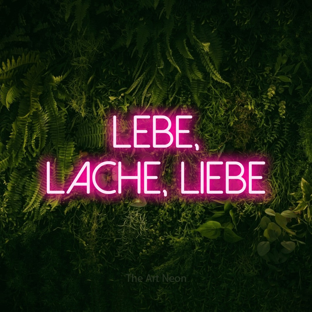 LED neon sign reading “Lebe, lache, liebe”, arranged in 2 lines.