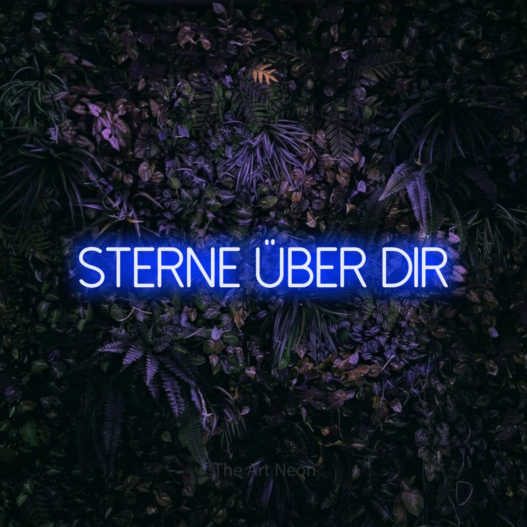 LED neon sign reading “sterne über dir”, arranged in a single line.