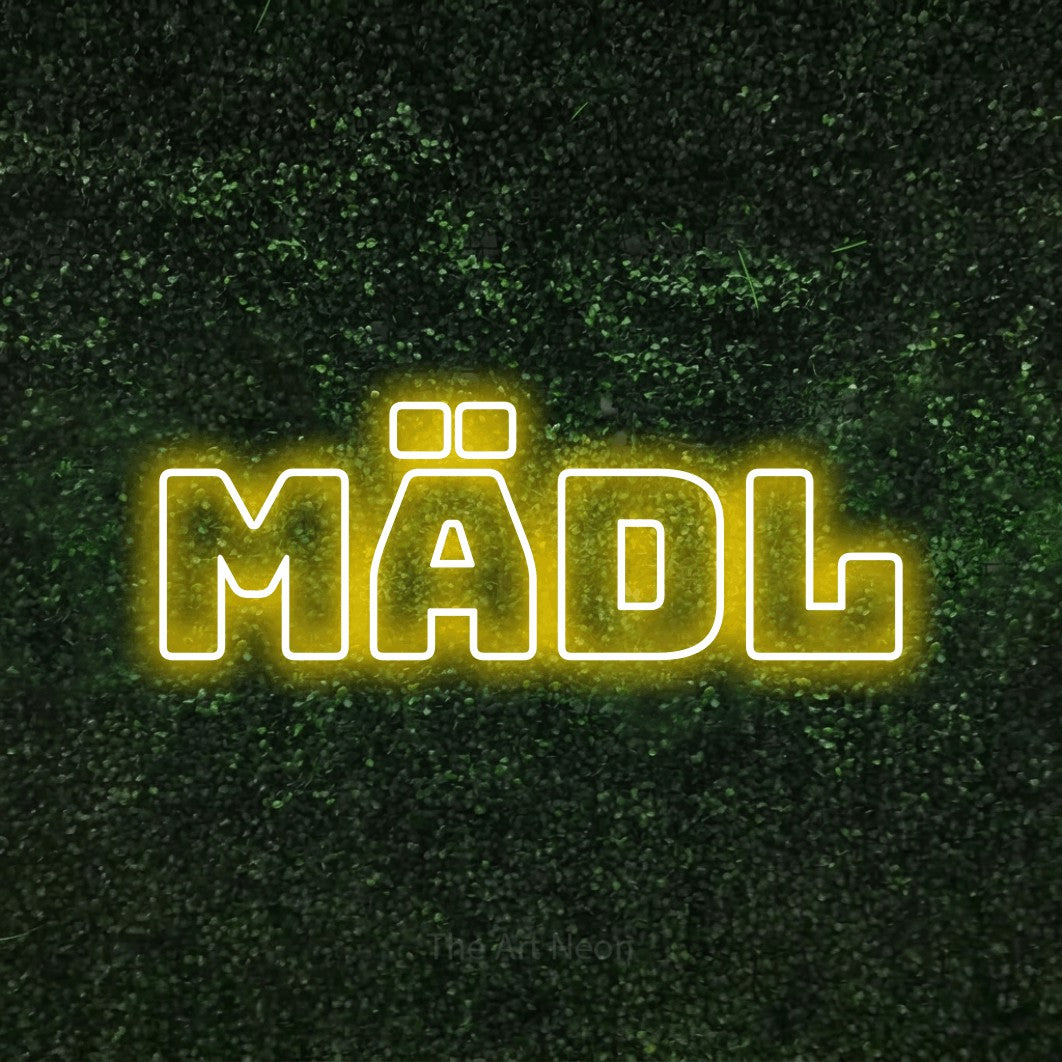 LED neon sign reading “MÄDL”, arranged in a single line.
