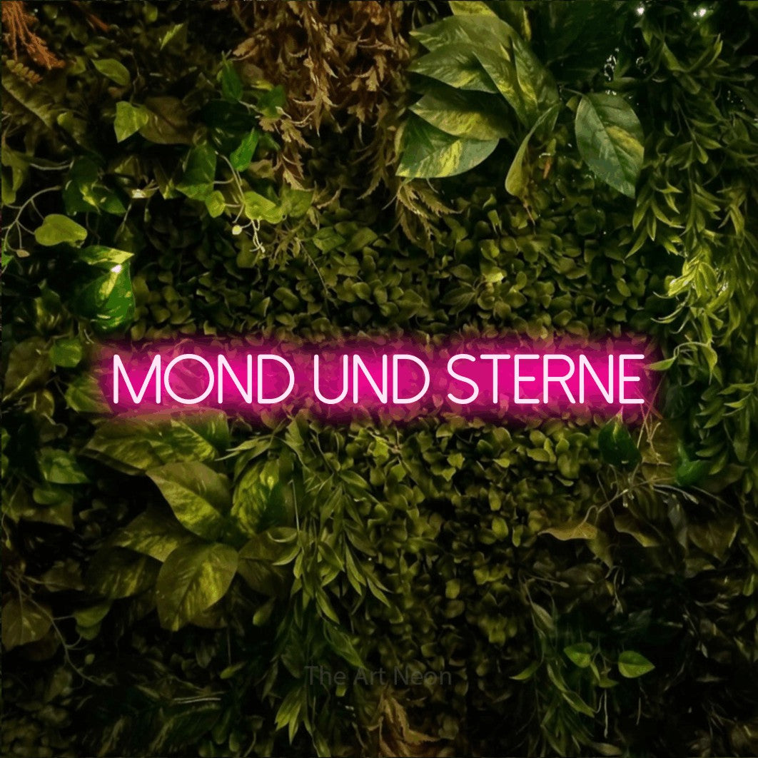 LED neon sign reading “Mond und Sterne”, arranged in a single line.