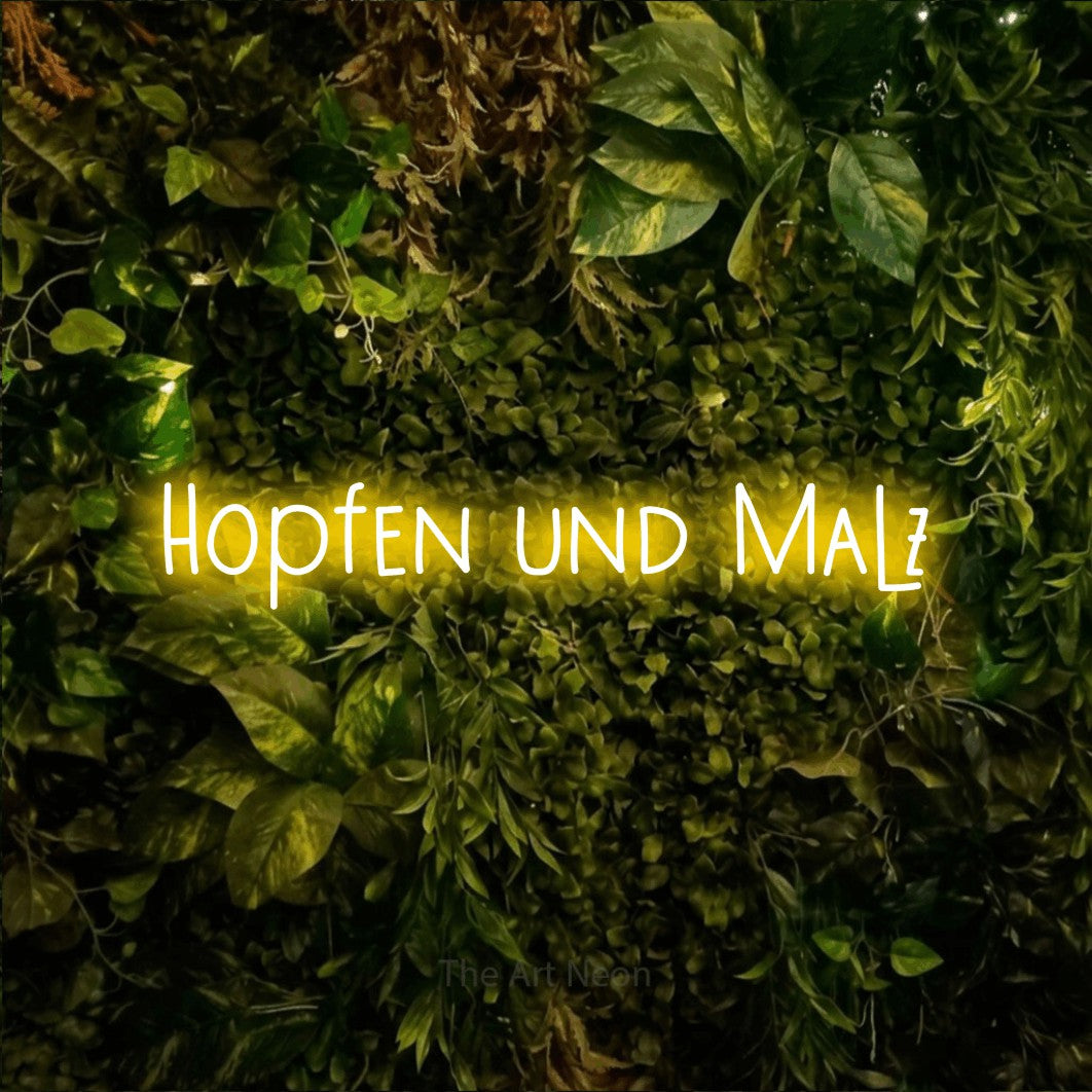 LED neon sign reading “Hopfen und Malz”, arranged in a single line.