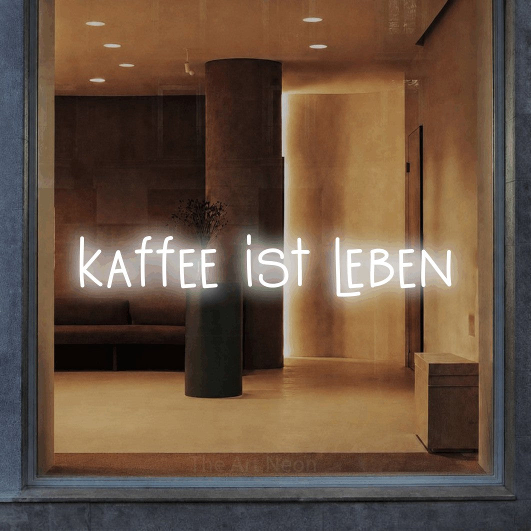LED neon sign reading “kaffee ist leben”, arranged in a single line.