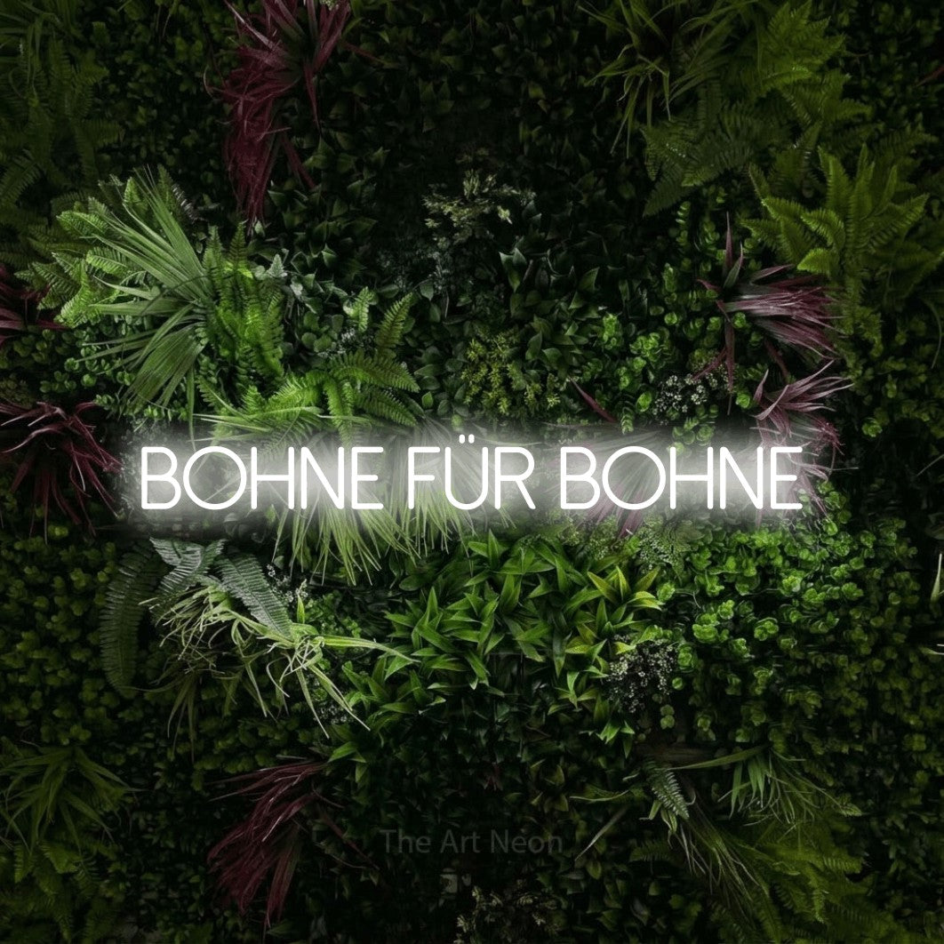 LED neon sign reading “Bohne für Bohne”, arranged in a single line.