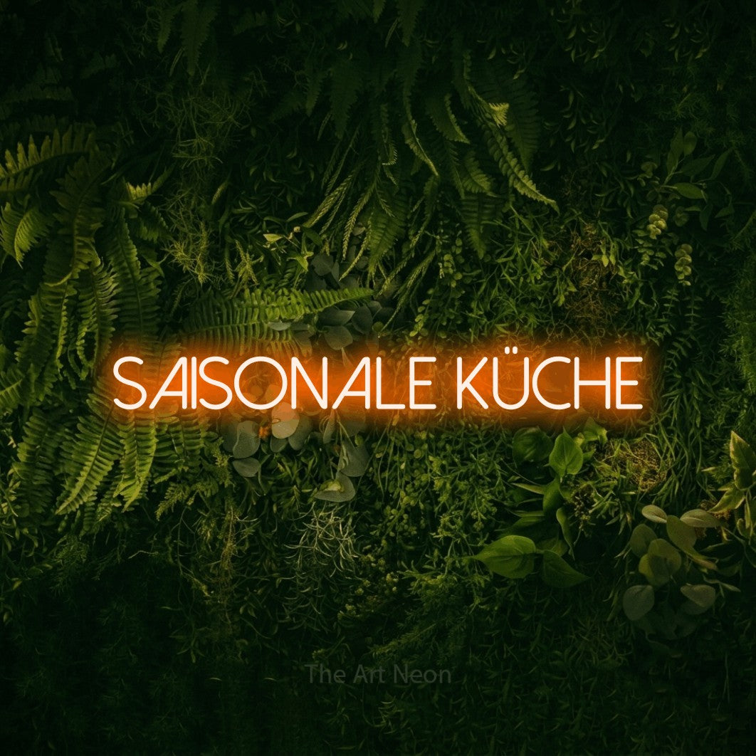 LED neon sign reading “Saisonale Küche”, arranged in a single line.