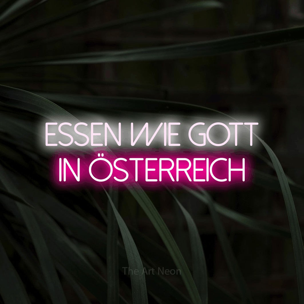 LED neon sign reading “Essen wie Gott in Österreich”, arranged in 2 lines.