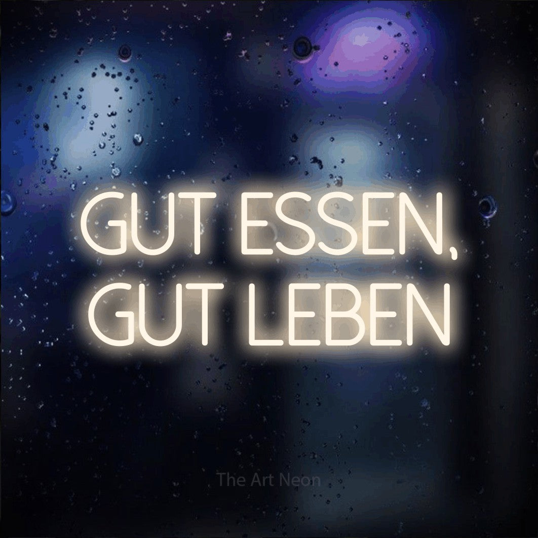 LED neon sign reading “gut essen, gut leben”, arranged in 2 lines.