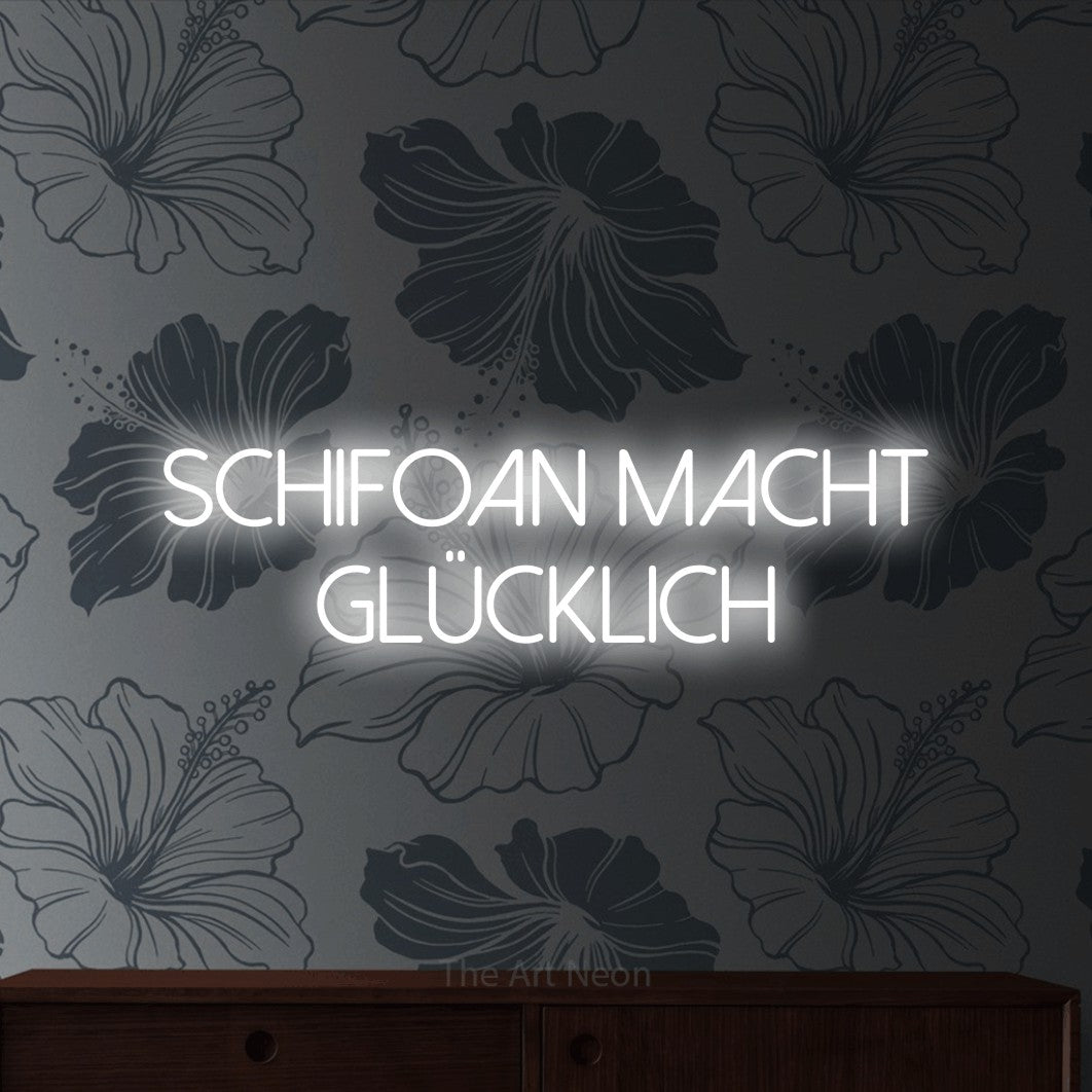 LED neon sign reading “schifoan macht glücklich”, arranged in 2 lines.