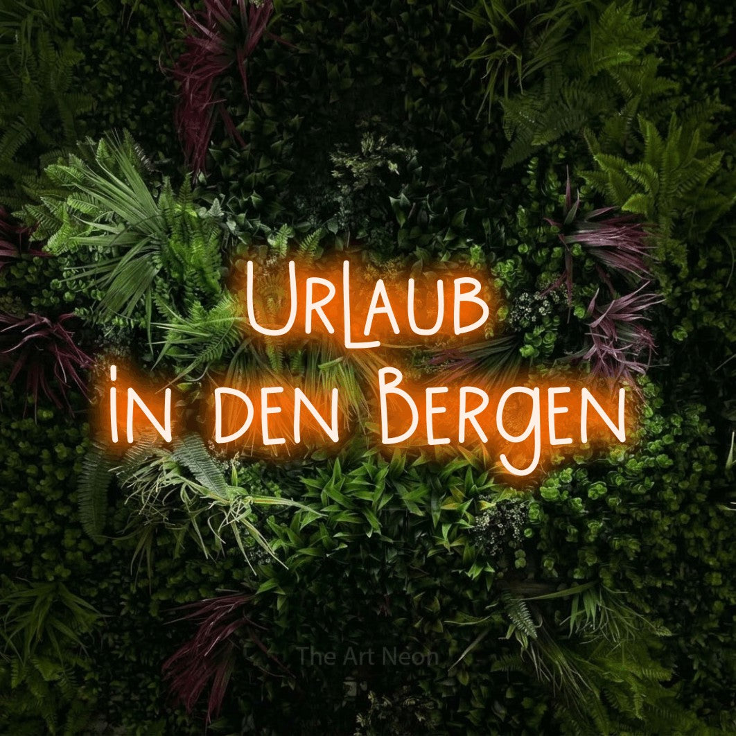 LED neon sign reading “Urlaub in den Bergen”, arranged in 2 lines.