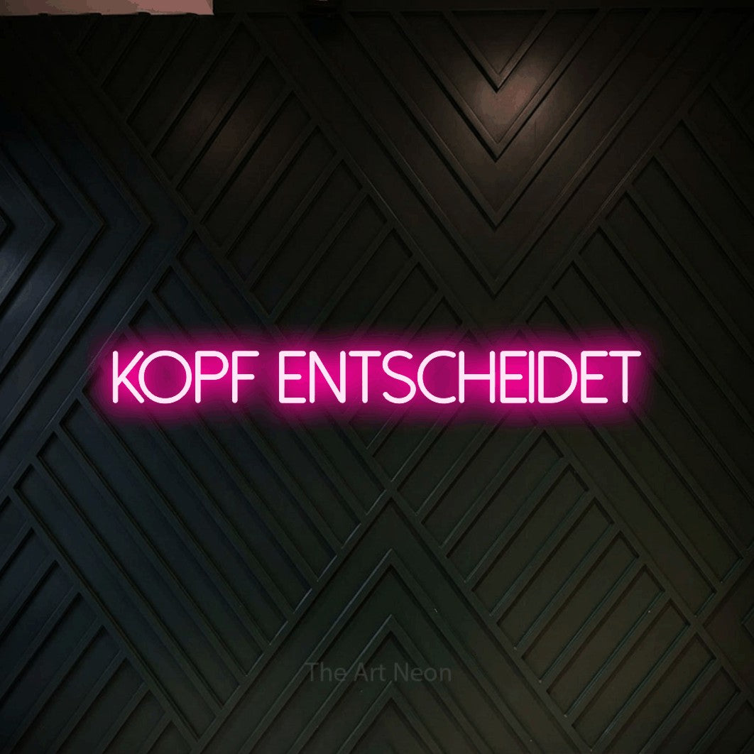 LED neon sign reading “kopf entscheidet”, arranged in a single line.