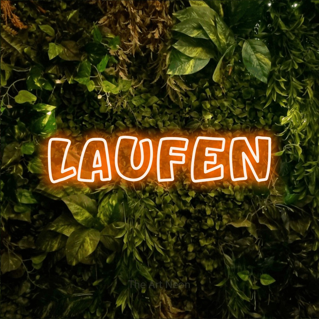LED neon sign reading “LAUFEN”, arranged in a single line.