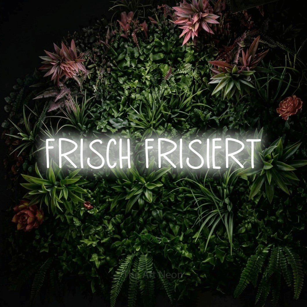 LED neon sign reading “FRISCH FRISIERT”, arranged in a single line.