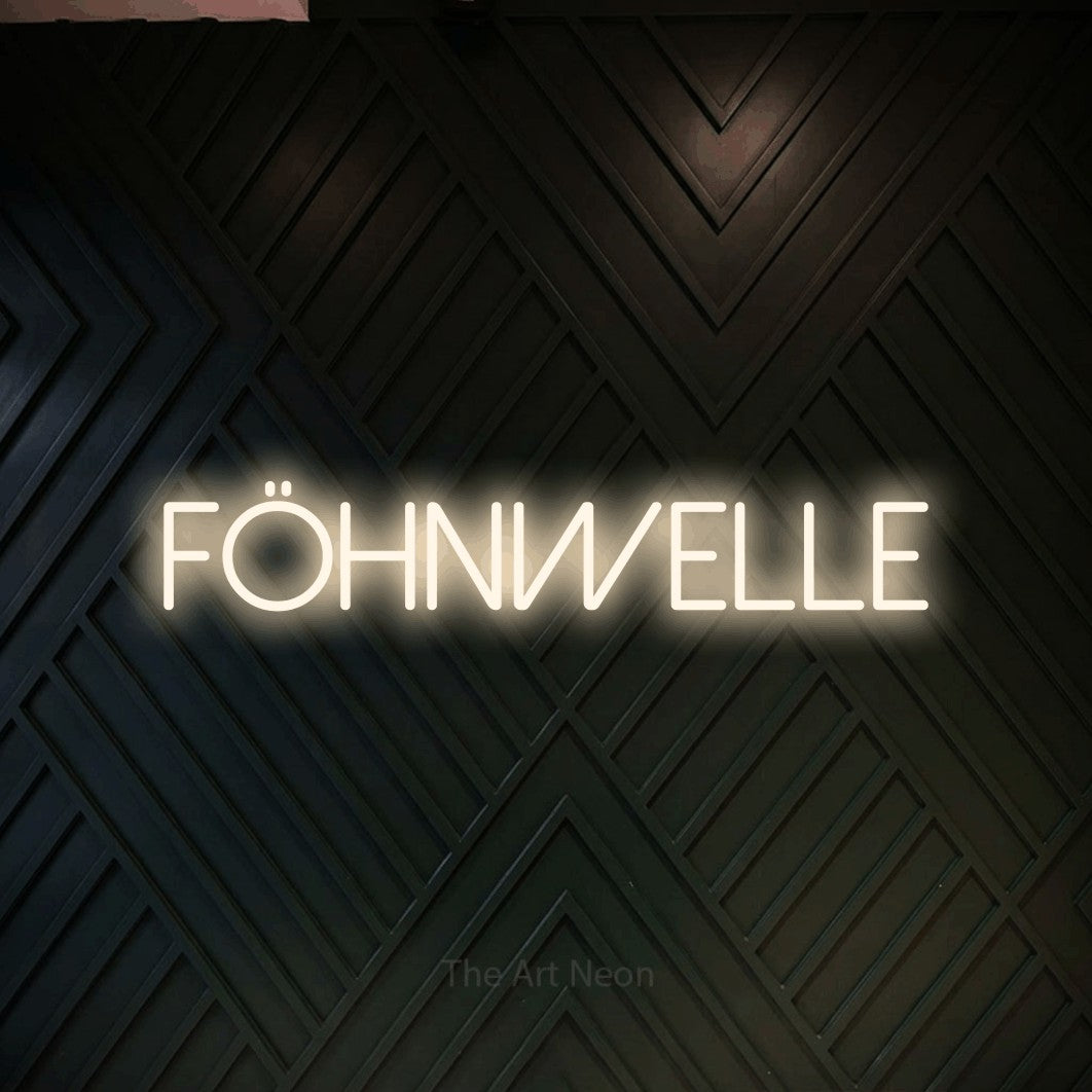 LED neon sign reading “Föhnwelle”, arranged in a single line.
