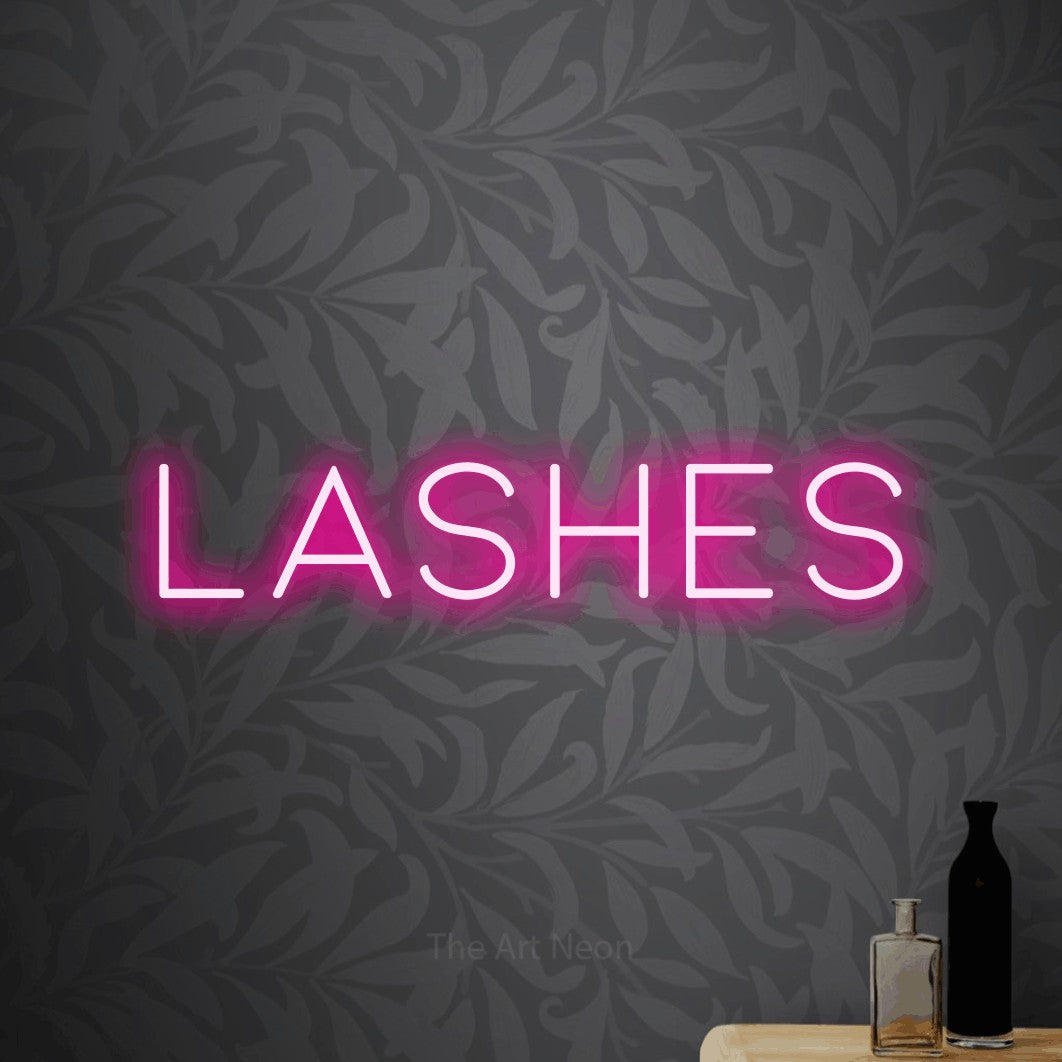 LED neon sign reading “lashes”, arranged in a single line.