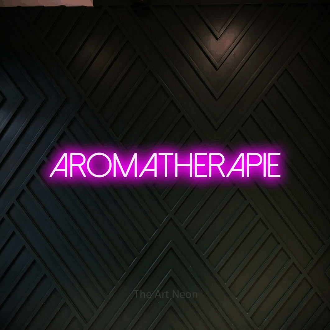 LED neon sign reading “aromatherapie”, arranged in a single line.