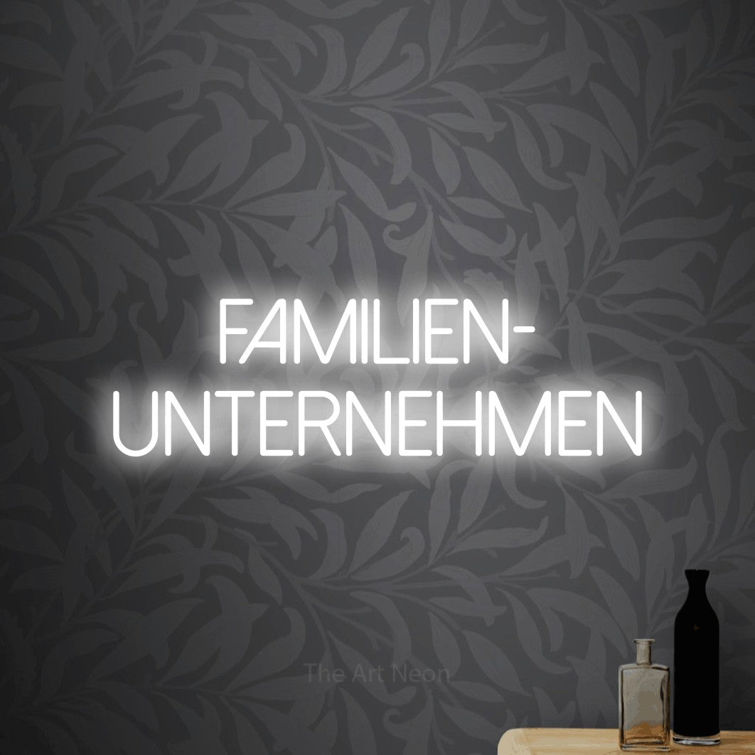 LED neon sign reading “Familien- unternehmen”, arranged in 2 lines.