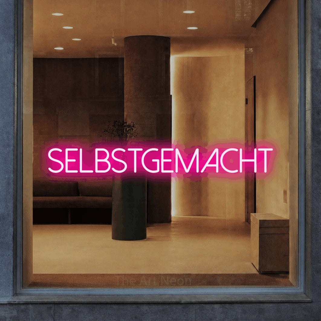 LED neon sign reading “SELBSTGEMACHT”, arranged in a single line.