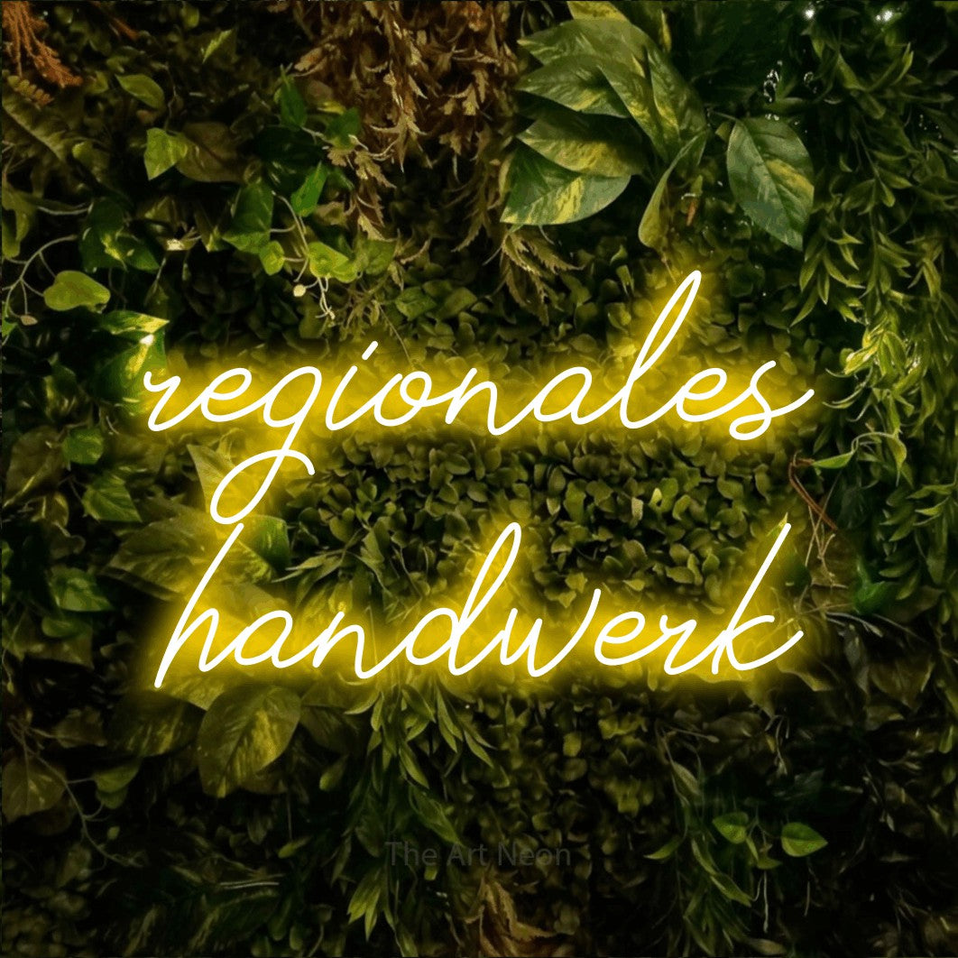LED neon sign reading “regionales handwerk”, arranged in 2 lines.