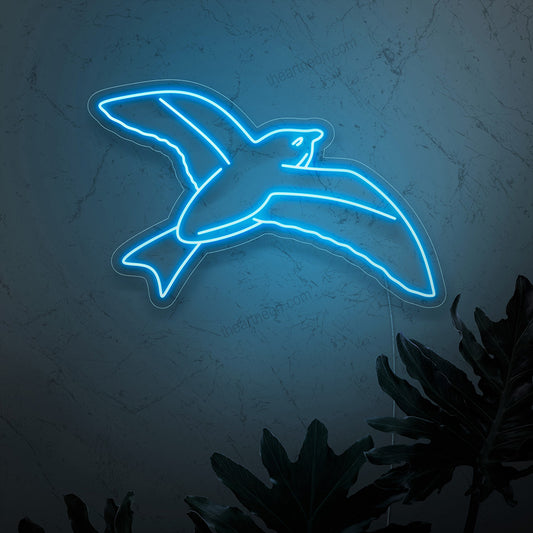 "Bird in Flight Neon Sign" - A graceful neon light featuring the silhouette of a bird in flight, infusing nature-inspired elegance and freedom into your living space.