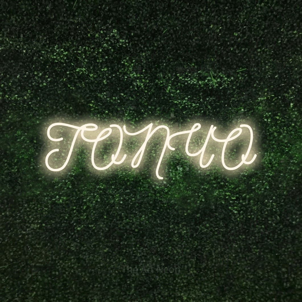 LED neon sign reading “ТОПЧО”, arranged in a single line.