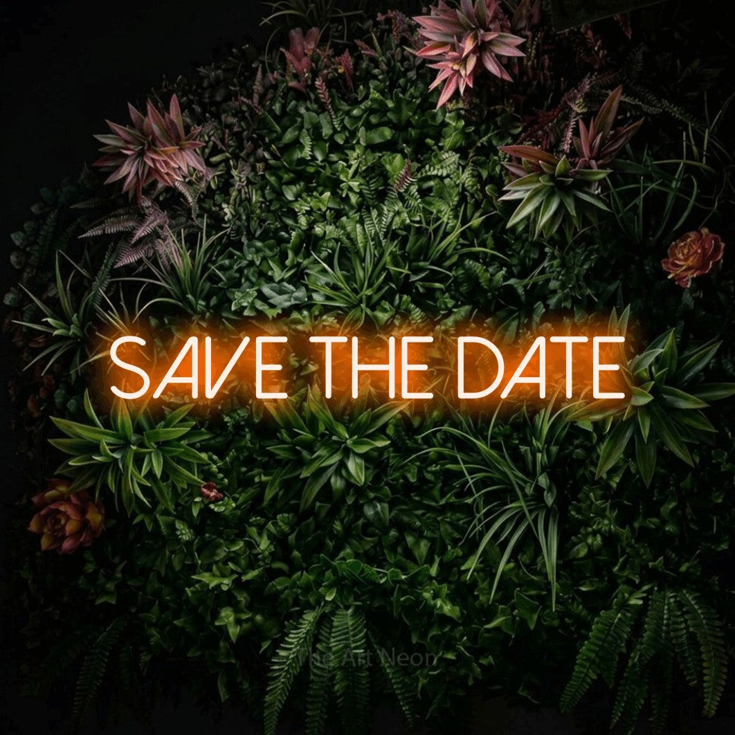 LED neon sign reading “Save the date”, arranged in a single line.