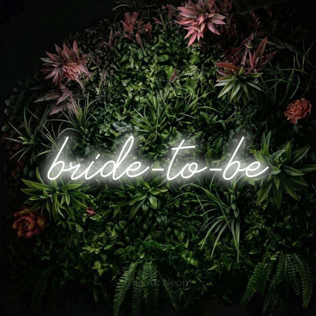 LED neon sign reading “bride-to-be”, arranged in a single line.