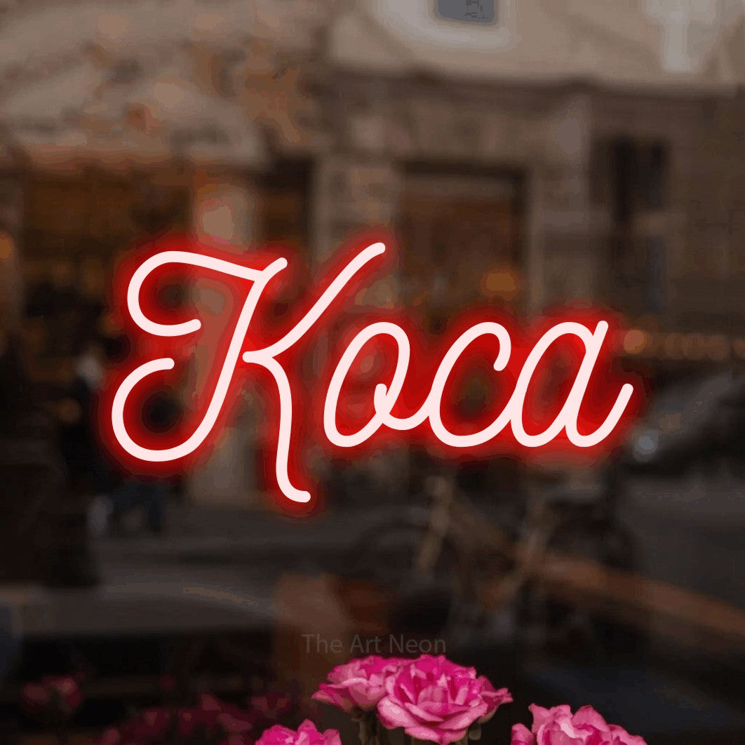 LED neon sign reading “Коса”, arranged in a single line.