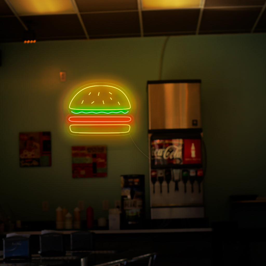 "Burger Neon Sign" - A mouthwatering neon light featuring the iconic symbol of a burger, infusing an atmosphere of deliciousness and a love for classic fast-food favorites into your burger joint or restaurant.