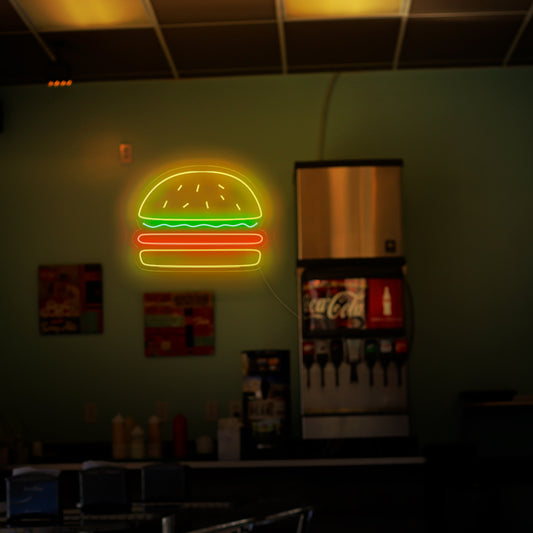 "Burger Neon Sign" - A mouthwatering neon light featuring the iconic symbol of a burger, infusing an atmosphere of deliciousness and a love for classic fast-food favorites into your burger joint or restaurant.