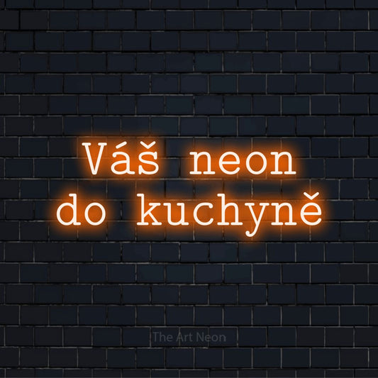 Neonový nápis na míru „Váš neon do kuchyně“ na černé cihlové zdi