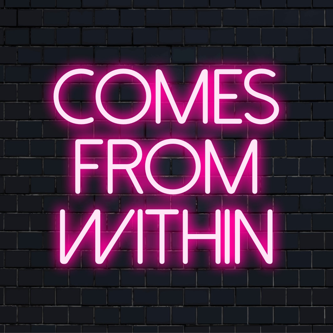 Custom LED neon sign reading Comes From Within, radiating vibrant glow, perfect for unique and inspiring decor.