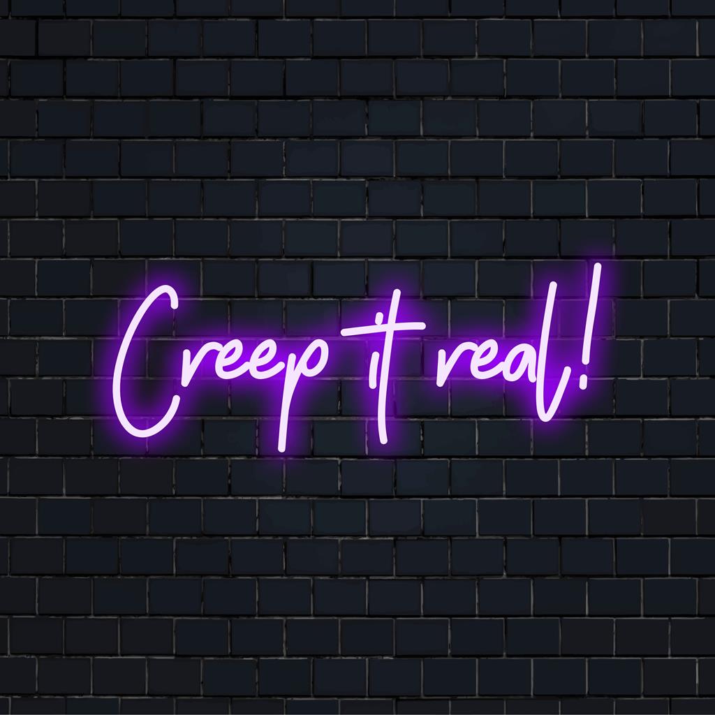 Enseigne néon LED vibrante « Creep It Real ! », parfaite pour ajouter une lueur surnaturelle à votre espace. Une décoration néon pleine de caractère.