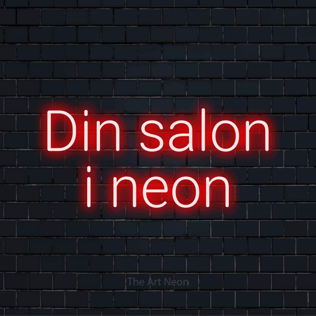 Personligt neonskilt med teksten “Din salon i neon” på en sort murstensvæg