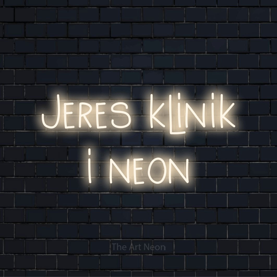 Personligt neonskilt med teksten “Jeres klinik i neon” på en sort murstensvæg