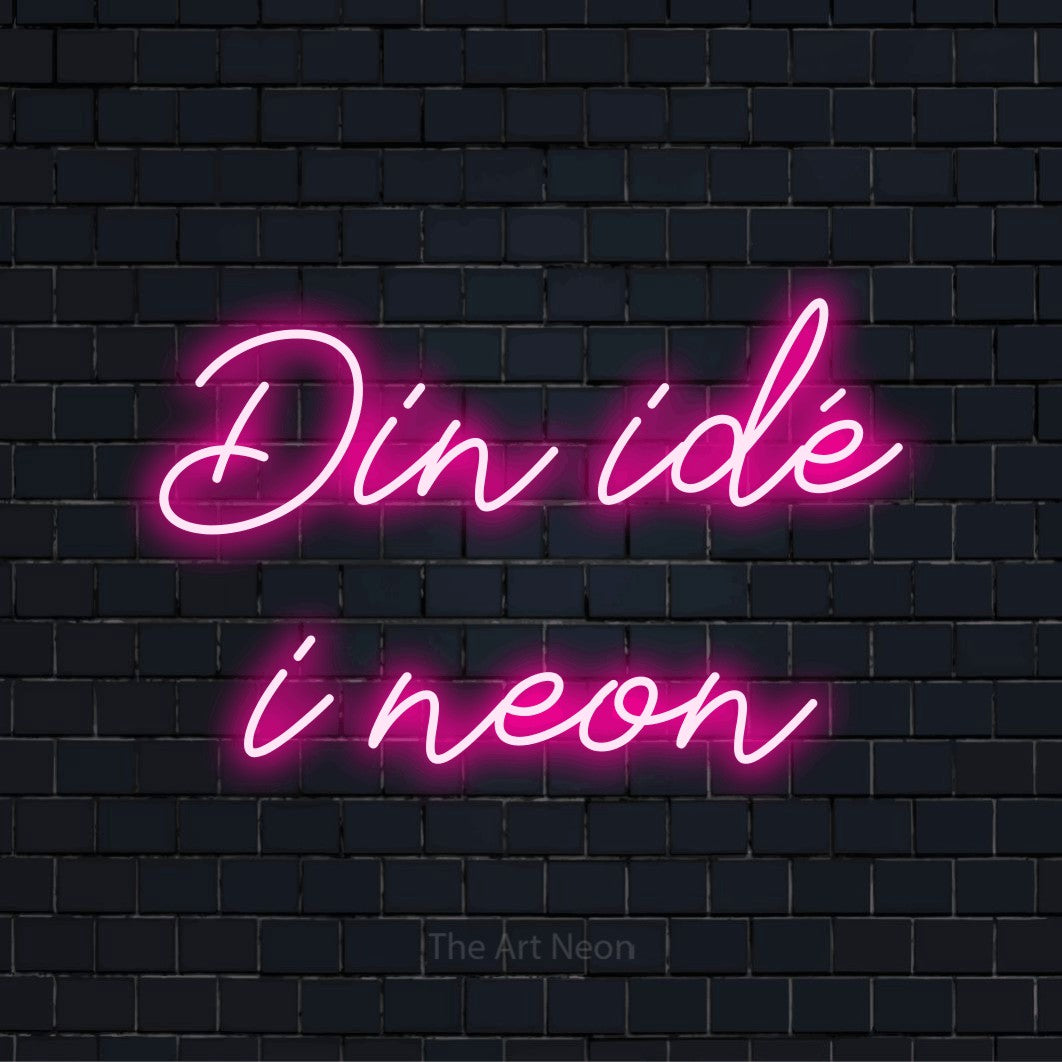 Personligt neonskilt med teksten “Din idé i neon” på en sort murstensvæg
