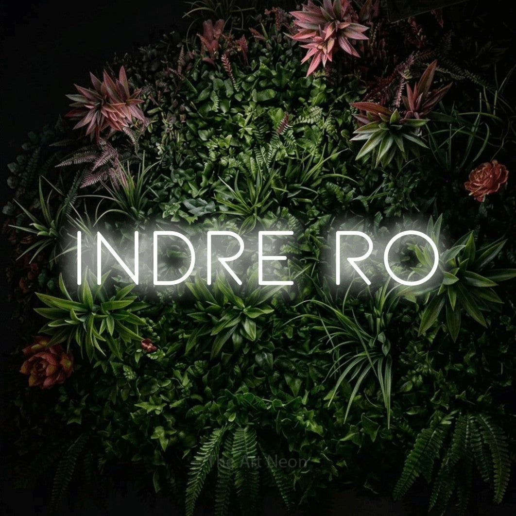 LED neon sign reading “Indre Ro”, arranged in a single line.