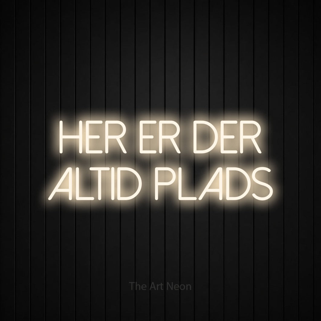 LED neon sign reading “her er der altid plads”, arranged in 2 lines.