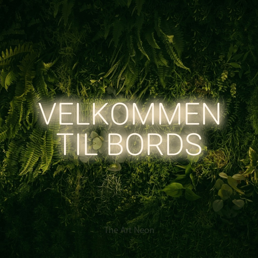 LED neon sign reading “VELKOMMEN TIL BORDS”, arranged in 2 lines.