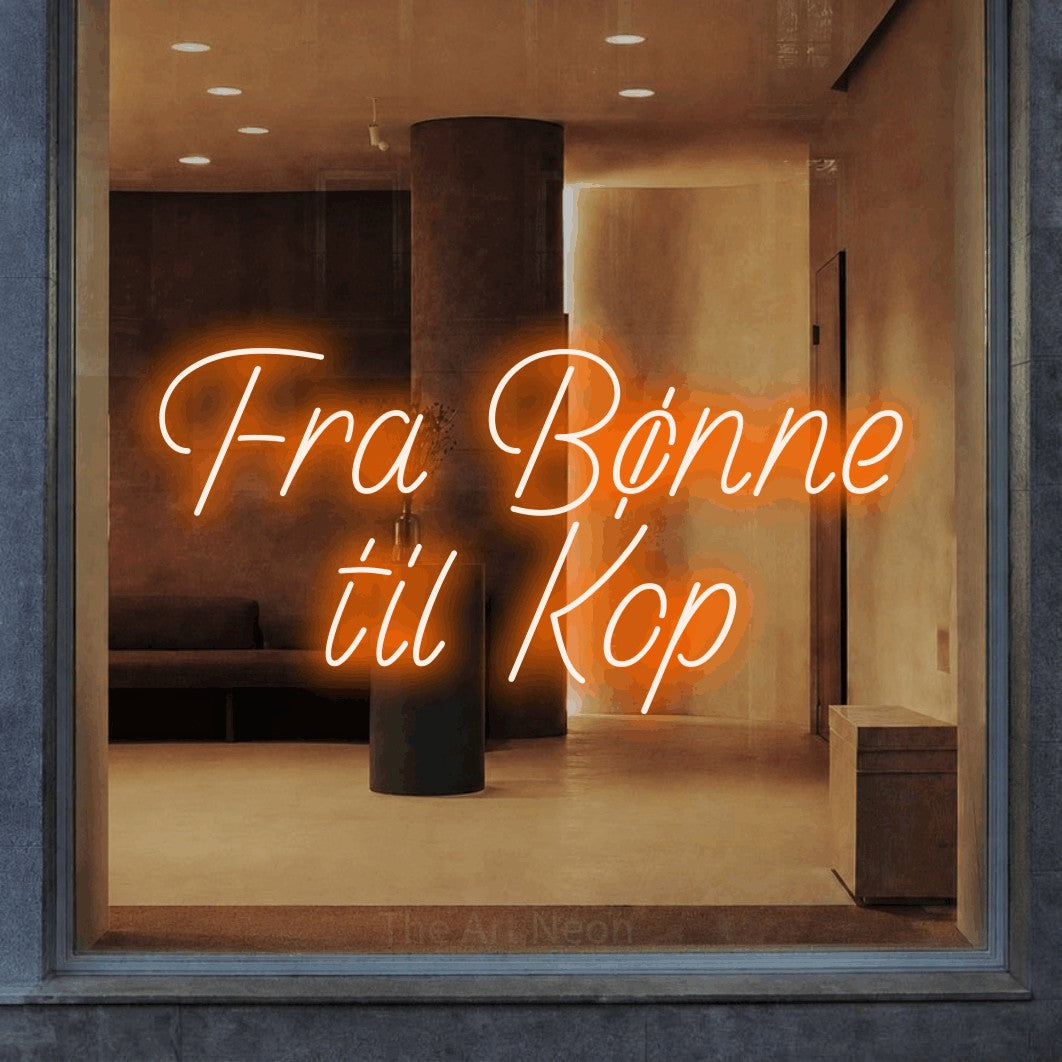 LED neon sign reading “Fra Bønne til Kop”, arranged in 2 lines.