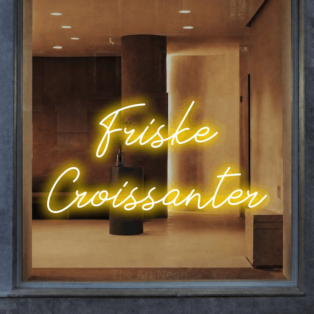 LED neon sign reading “Friske Croissanter”, arranged in 2 lines.