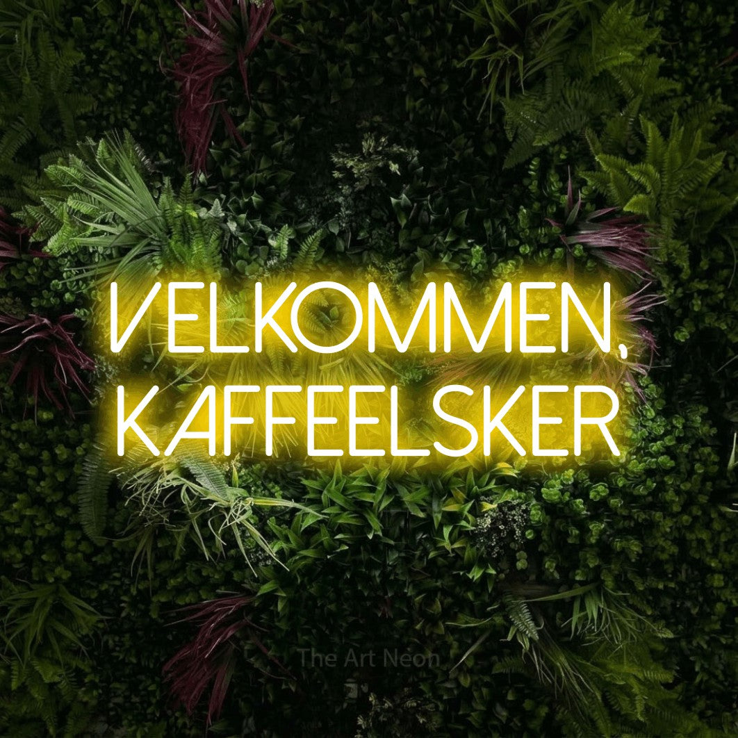 LED neon sign reading “VELKOMMEN, KAFFEELSKER”, arranged in 2 lines.