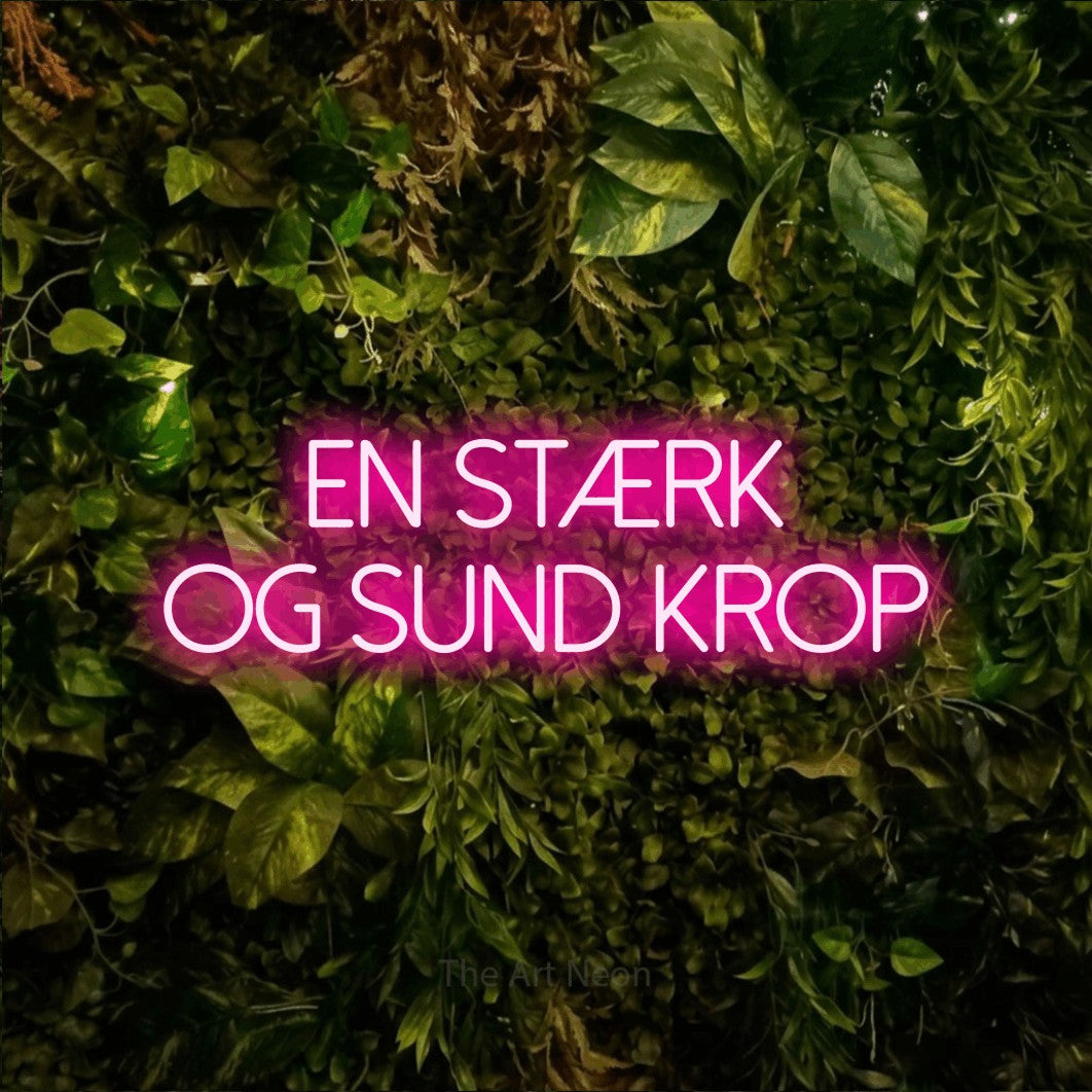 LED neon sign reading “EN STÆRK OG SUND KROP”, arranged in 2 lines.