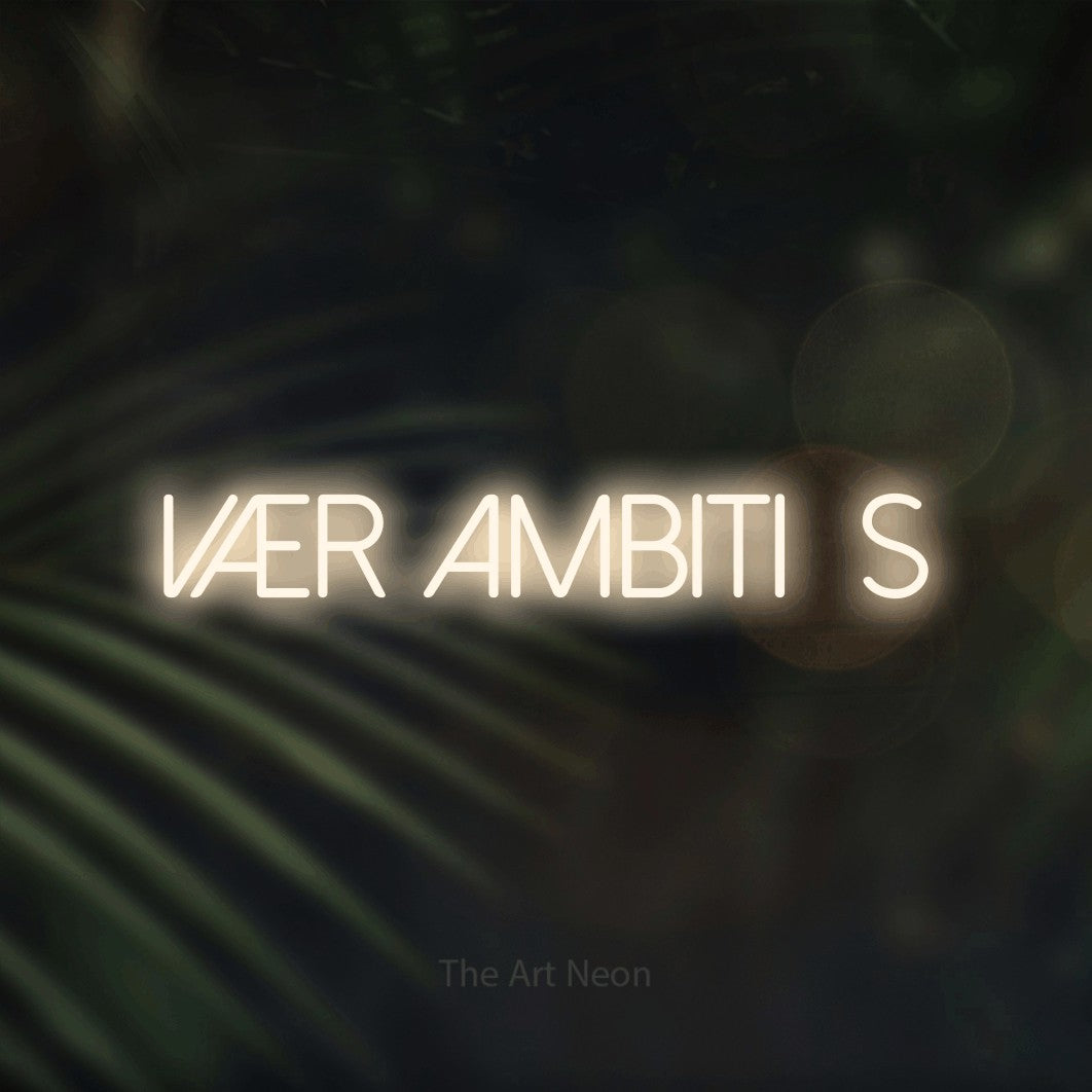 LED neon sign reading “vær ambitiøs”, arranged in a single line.