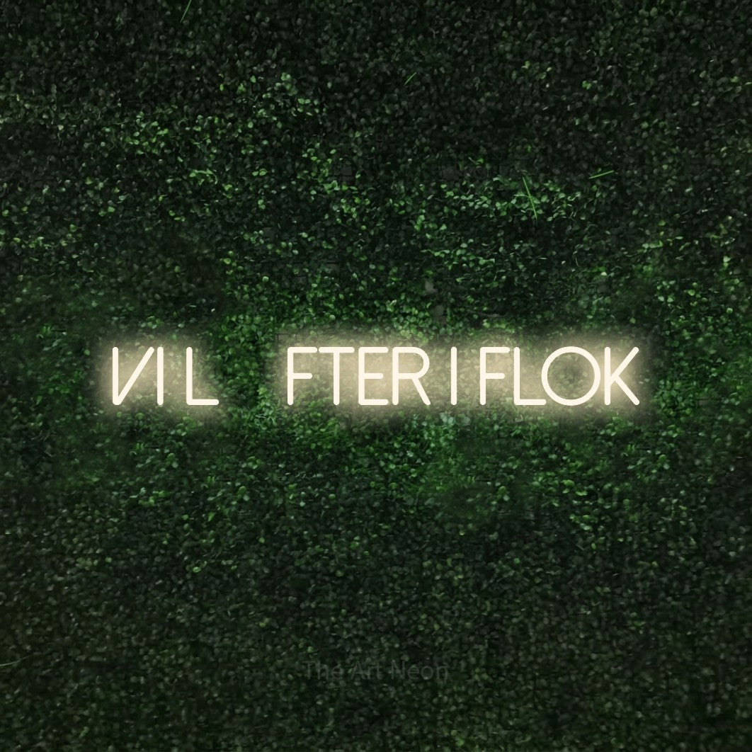 LED neon sign reading “VI LØFTER I FLOK”, arranged in a single line.