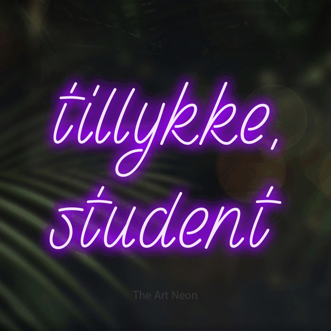 LED neon sign reading “tillykke, student”, arranged in 2 lines.