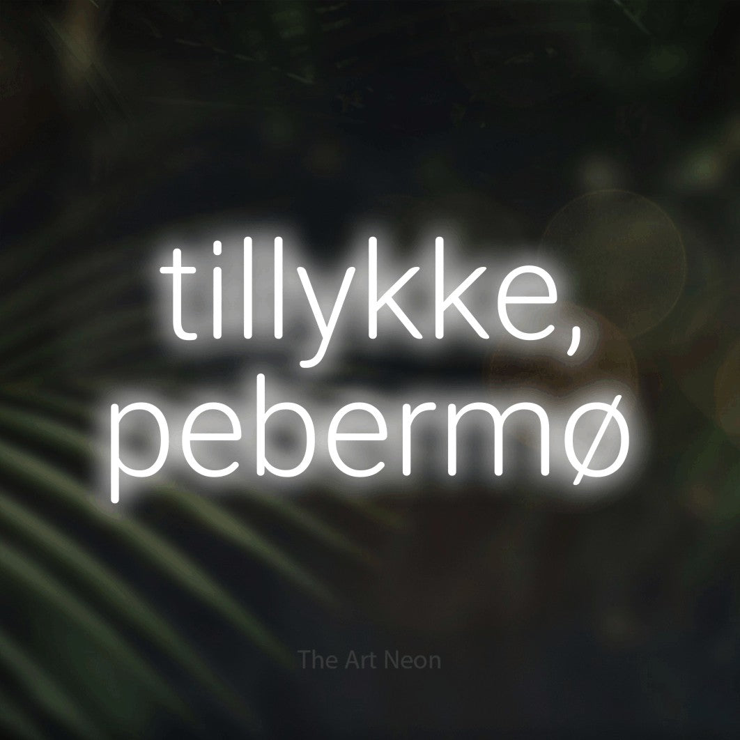 LED neon sign reading “tillykke, pebermø”, arranged in 2 lines.