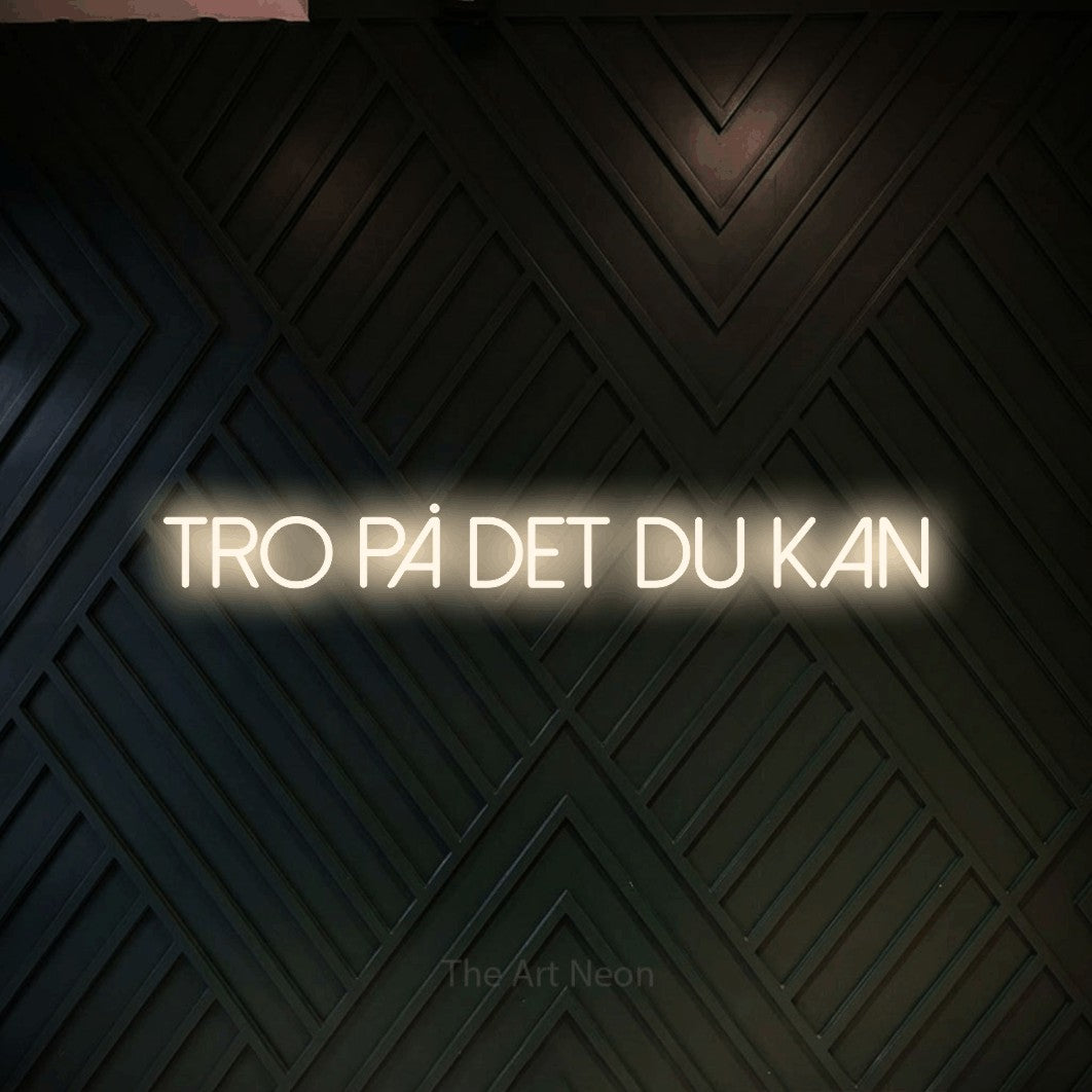 LED neon sign reading “Tro på det du kan”, arranged in a single line.